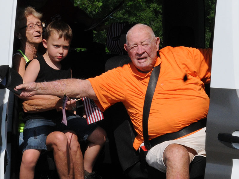 Joe Brandon waved from the Disabled American Veterans (DAV) van Saturday. The parade preceded the Independence Day ceremony held at Veterans Memorial Park.