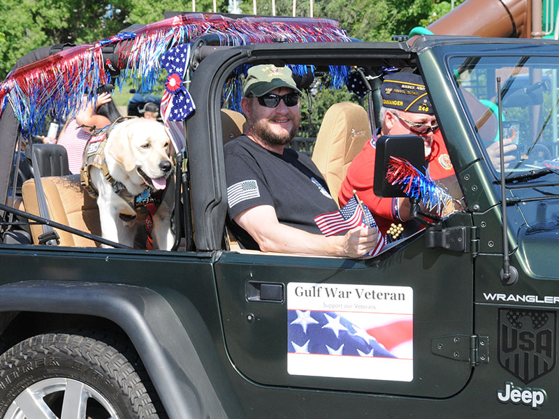 Gulf War veteran Shane Baugh and a friend enjoyed their ride through downtown Blue Ridge in the parade July 4.