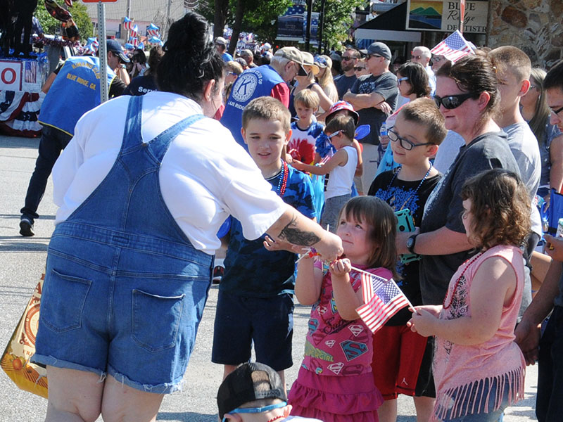 Children along the parade route in downtown Blue Ridge were treated to candy and other treats by several of the parade participants.