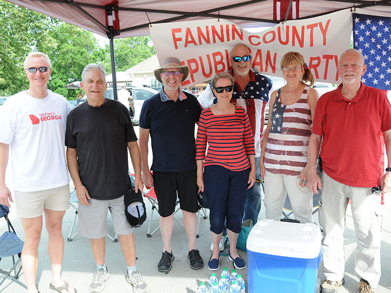Members of the Fannin County Republican Party were on hand in McCaysville Saturday evening to say Happy Fourth of July with candy for the young and young at heart, and water to help quench the effects of the Saturday heat. Shown are, from left,  party Chairman Frank Wood, Mark Mitchell, Ben Thatcher, Nancy Thatcher, Charles Hukriede, Marsha Dunn, and Fred Cory.