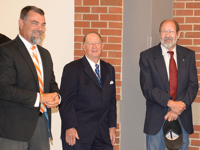 Fannin County School System Associate Superintendent Darren Danner, left, welcomed visitors to the ribbon cutting marking the official opening of the system’s new Staff Development Center last week. Among those on hand were school board members Bobby Bearden, center, and Lewis DeWeese.