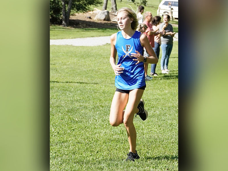 Lindsey Holloway makes her way to the finish line during the race at Meeks Park Saturday, August 26. Holloway placed second in the girls’ division.