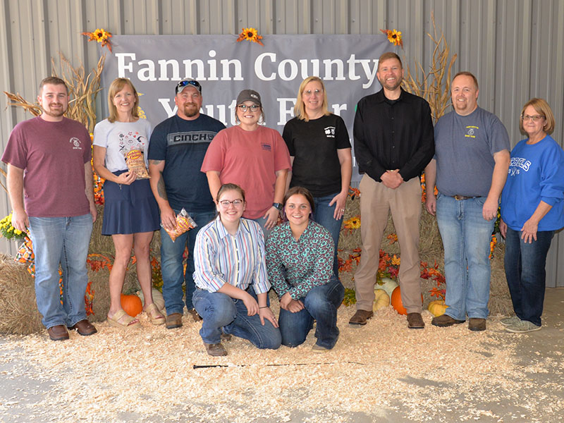 The Fannin County Alumni Association Youth Fair involves volunteers, school officials, and students all working together to make the event  a success for the young people who take part. Shown at the conclusion of the Saturday, September 17, event are, from left, front, Emmie Thomas and Zoe Putnam; and, back, Seth Davis, Shannon Miller, Terry Flowers, Emily Fellenbaum, Jennifer Larson, Dr. Michael Gwatney, Tim Nicholson, and Gigi Thomas.