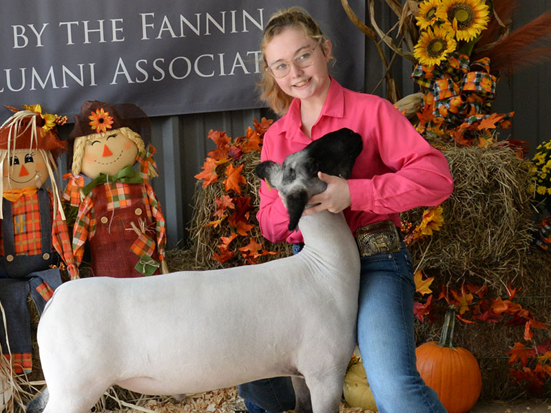 Addison McDermott of Fannin County 4-H has her hands full with her sheep.