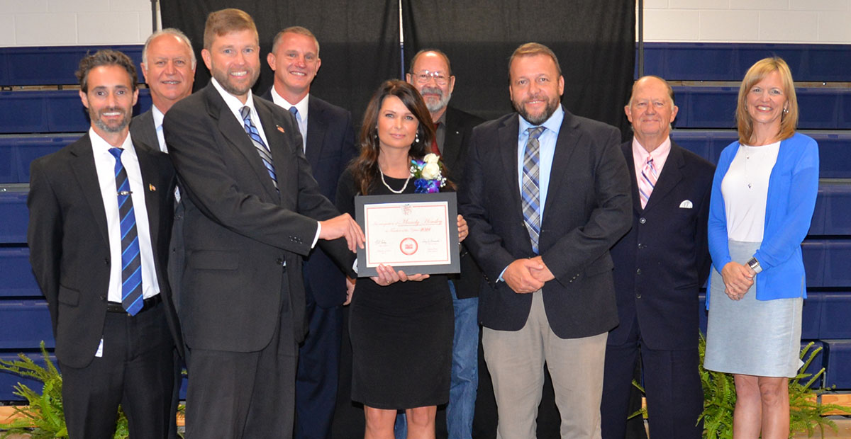 Fannin County High School’s Mandy Housley received special congratulations after being named Teacher of the year. She is shown with from left, front, Lucas Roof, Dr. Michael Gwatney, Housley, Dr. Scott Ramsey, Bobby Bearden, Shannon Miller, and, back, Terry Bramlett, Chad Galloway and Lewis DeWeese.