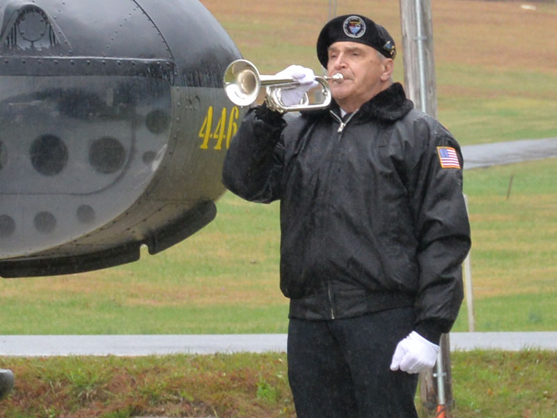 Bill Hall played Taps to conclude the Veterans Day ceremony Saturday.