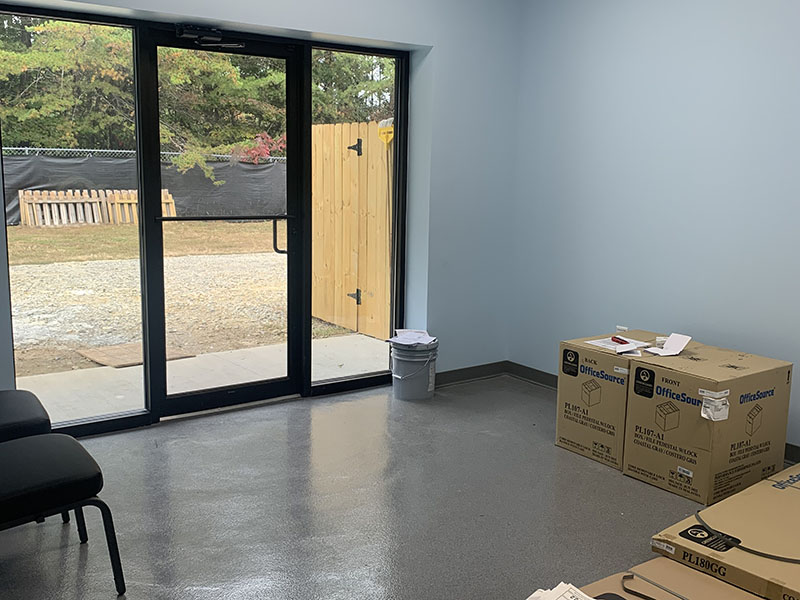 The lobby/reception area of the new Humane Society of Blue Ridge clinic is shown almost completed with a view of the yard outside.