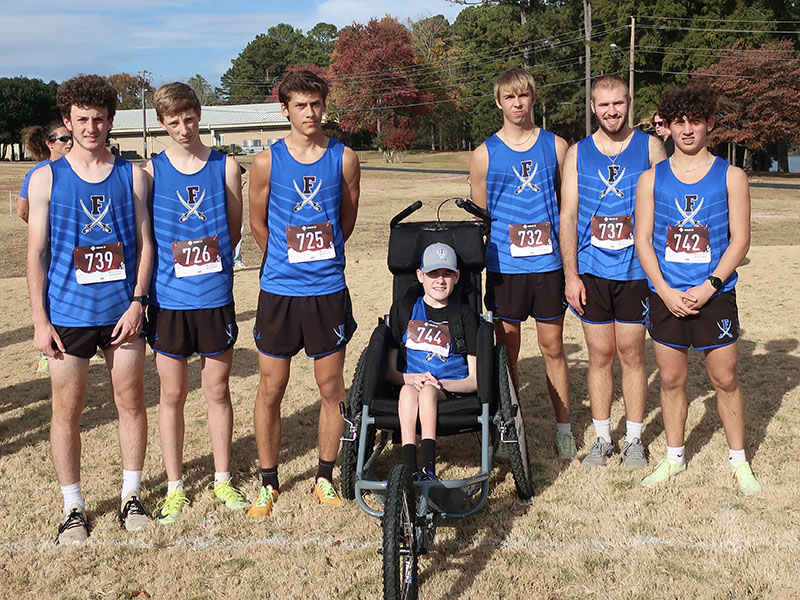 The FCHS Rebels cross country team smiles after placing second in the Region Meet Tuesday, October 25. Shown are, from left, Conner Kyle, Luke Callihan, Benjamin Bloch, Brady Smith, Gavin Davis, Sam Jabaley and Zechariah Prater. 
