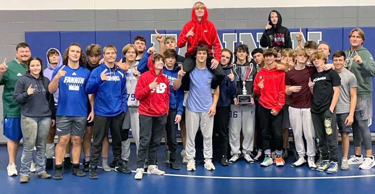 The FCHS Wrestling team smiles and holds up a #1 after being awarded their 515 Classic Championship trophy. Shown are, from left, Coach Chuck Patterson, Chelsey Frye, Drake Cantrell, Jacob Dye, Matthew Crowder, Carson Collis, Taylor Collis, Logan Long, Landon Poole, Thomas Golden, Jackson Mercer, Corbin Davenport, Blake Summers, Colby Shaw, Cooper Moreland, Conrad Head, Lionel Olivera, Andrew Crowder, Tristan Siler, Christen Newberry, PJ Cole, Jayden Brown, Keaton Wilson, Jacob Green, Finn Thoreson, Braylin