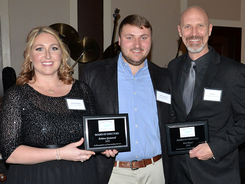 Two outgoing members of the Fannin County Chamber of Commerce Board of Directors, Britton Quintrell, center, and Rob Kaser, were recognized for their service by Suzanne Davenport, chairwoman of the chamber board of directors.