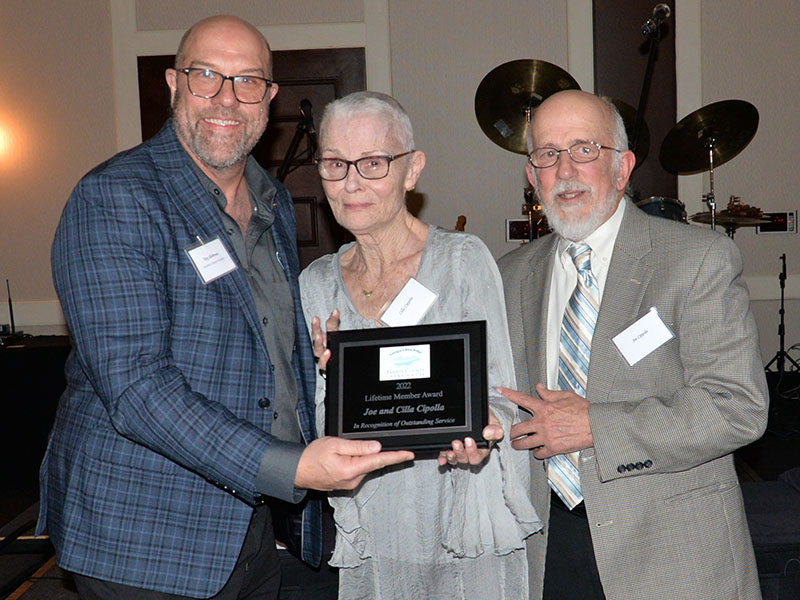 The Fannin County Chamber of Commerce honored Joe and Cila Cipolla with a Lifetime Member Award Saturday night. Troy Shirbroun, left, presented the Cipollas with the honor.
