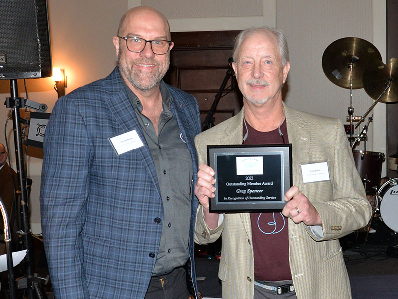 Greg Spencer, right, was honored as the Fannin County Chamber of Commerce’s Outstanding Member. Troy Shirbroun presented the honor. Spencer was honored for his work with Blues & BBQ, Snack in a Backpack, and several other volunteer efforts.