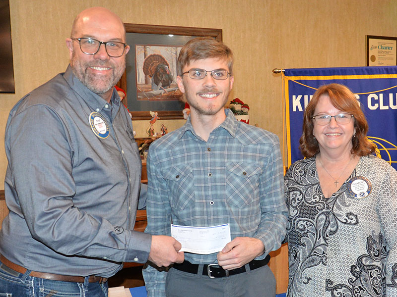 Troy Shirbroun of the Kiwanis Club of Blue Ridge presented James Kyle a $1,000 in recognition of being named this years Student Teacher Achievement Recognition (STAR) student. Kiwanian Sharon McFarland is at right.