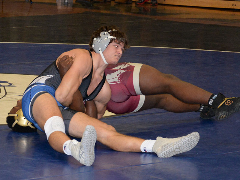 Senior Corbin Davenport works hard for a pin in his match against a Washington Saturday, January 14. 