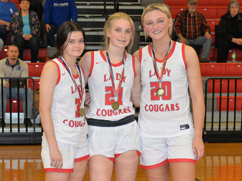 From left, Brilee Harris, Alexis Hyatt and Sapporiah Ross were selected for the All-District Tournament team. 