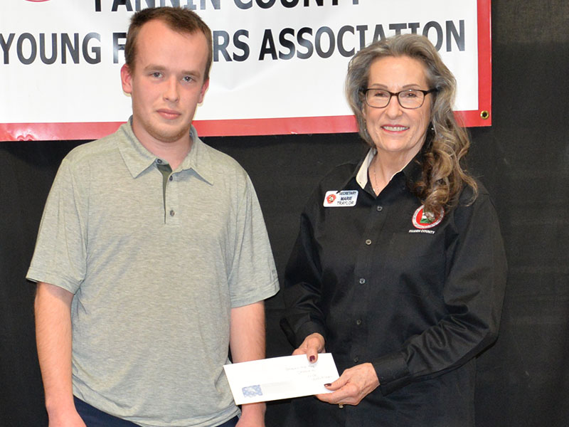 Nick Wolschlager was named the Beginning Agriculture Producer by the Fannin County Young Farmers Association. He was presented his award by Marie Taylor, representing both the Young Farmers and North Georgia Master Gardeners.