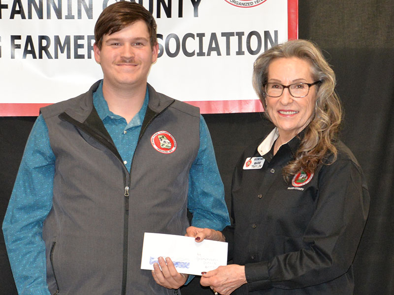 Patrick Conner was named the Agriculture Spokesperson for his participation in the Georgia Young Farmers State Conference. Marie Taylor presented Conner his award.