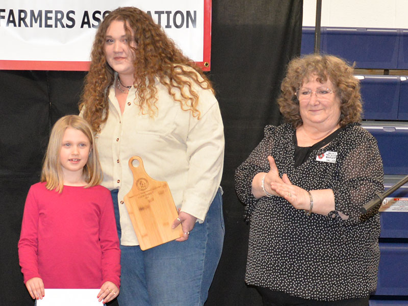 Terri Long, center, the owner of Longs Family Farm, accepted the honor as Farm Family for 2022. Margery Dallas, right, presented the award to Terri and her daughter.