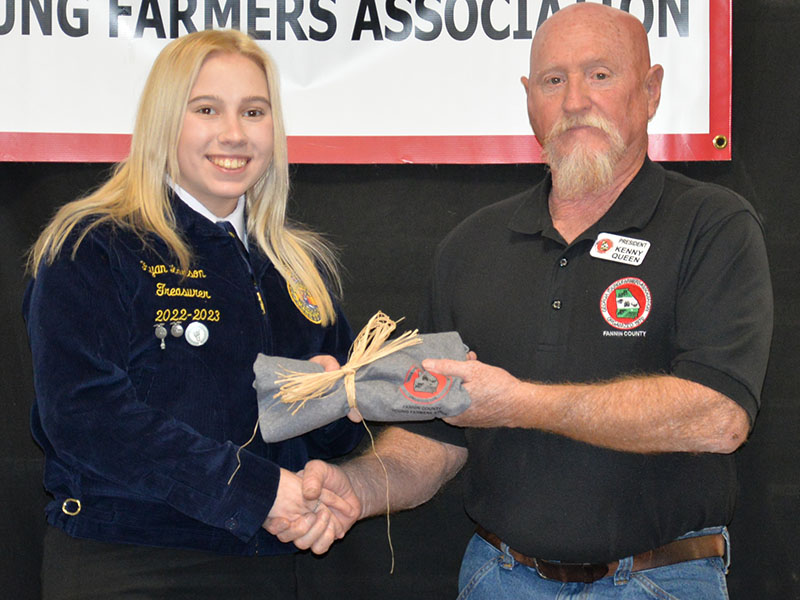 Ryan Larson was one of four Fannin County High School graduating seniors honored for their contributions. She accepted her award from Kenny Queen.
