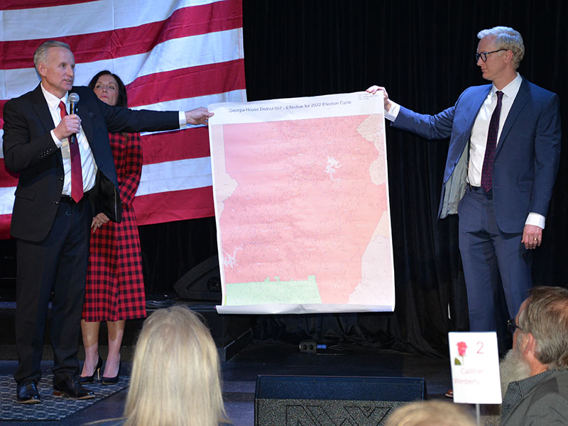 Johnny Chastain, newly elected District 7 representative to the Georgia House, and Fannin County Republican Party Chairman Frank Wood display a map of Chastain’s district. In the background is Chastain’s wife, Stacy.