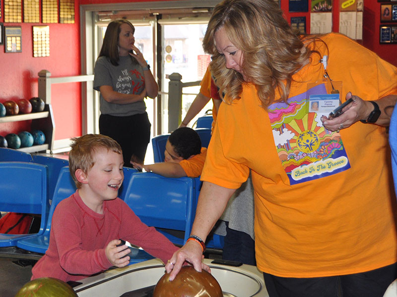Blue Ridge Elementary first grader Sterling Shook is all smiles as he gets ready for his turn to bowl at last week’s Special Olympics event. Pictured with him is Tammy Pierce.