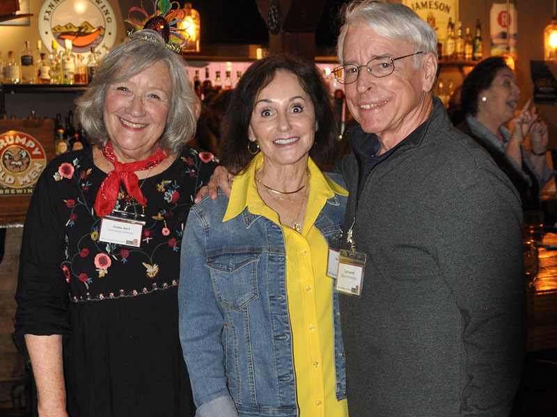 Snack in a Backpack Executive Director Debby Beck, left, is pictured with Leslie and Curt Jarrett at this year’s Champions for Children event at Fightingtown Tavern.