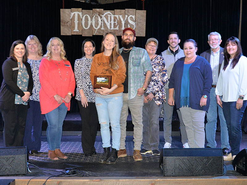 Tooney’s Music Venue in McCaysville was one of four Copper Basin area businesses welcomed by the Polk County Chamber of Commerce as members last week. Shown during a plaque presentation are chamber and Tooney’s representatives, from left, Jenny Mundy, Ellen Raper, Lynne McClary, Amanda Hill, Emily Hawkins and Joshua Hawkins from Tooney’s, Colleen Fults, Bryan Clary, Kat Yeoman, James Woody, and Sarah Berry.