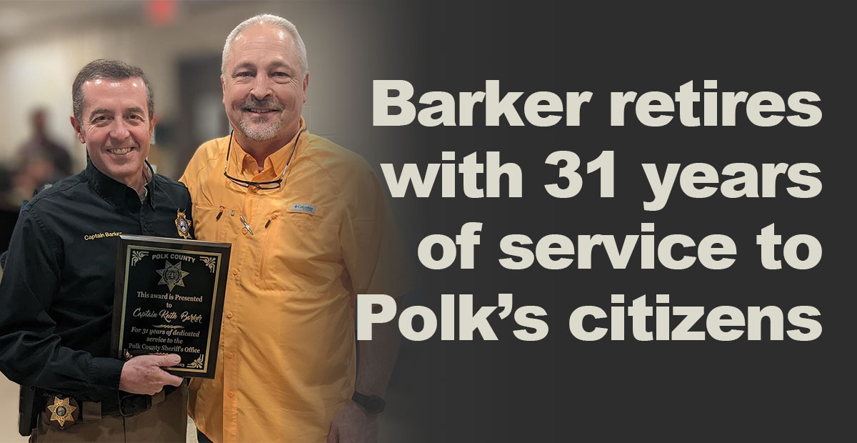 Polk County Sheriff Steve Ross, right, presented Keith Barker a plaque recognizing his 31 years of service to the sheriff’s office and the citizens of Polk County.