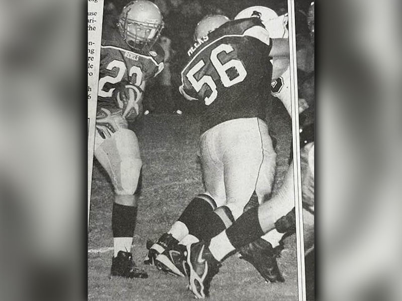 Bryant Meeks creates a hole for a Rebel running back during his high school career. 