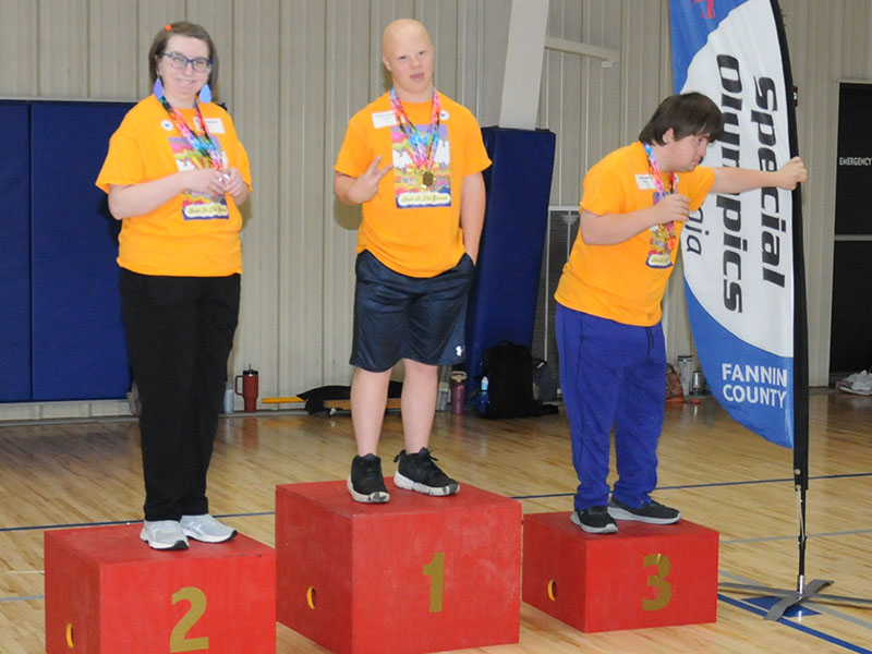 Mountain Area Christian Academy participants Sarah Campbell, Austin Pankey and Brady Spry stand proudly as winners in the Fannin County Special Olympics Track and Field event last Friday at the Fannin County Recreation Department.