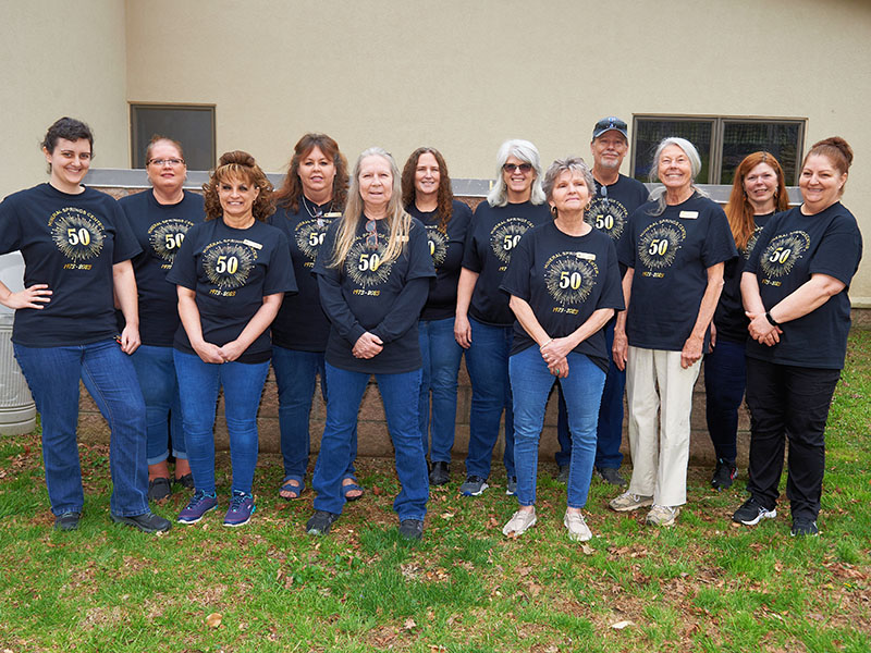The staff at Mineral Springs Center gathered during the 50th Anniversary Celebration at the facility in Blue Ridge. Shown are, from left, Faith Fuller, Tara Ledford, Angie Green, Stacey Nicholson, Karen Kinchen, Cindy Moss, Robin Davenport, Carol Brown, David Messer, Diane Bond, Kelly Messer, and Tina Banner. Not pictured are Holly Waters and Penny Bradburn.