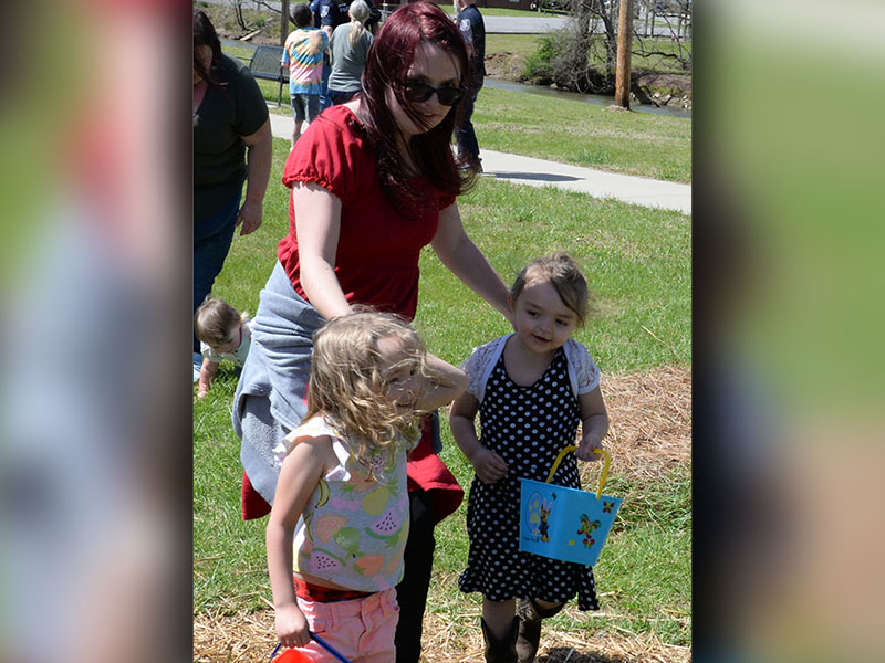 These young ladies got a little help as they hunted Easter Eggs in the Toccoa River Park.