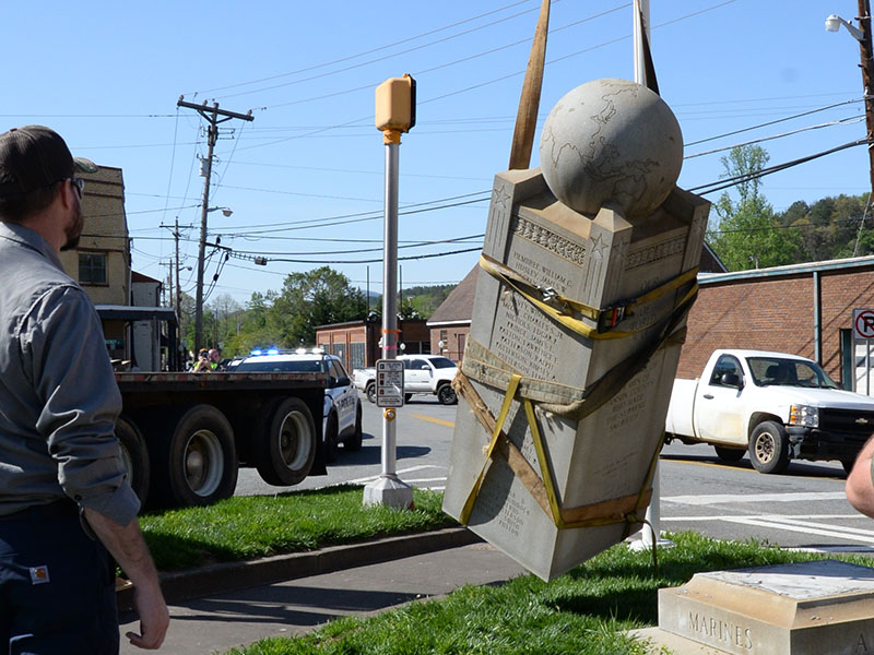 McCaysville Water Department Superintendent Davy Ensley watches as the Veterans Monument breaks free of its base. During the move, the monument was estimated to weigh six tons.
