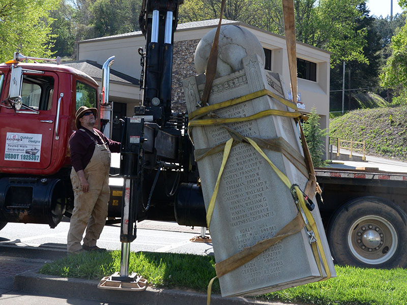 Lee Dillard took extra care moving the monument from its base to a safe resting position on his truck.
