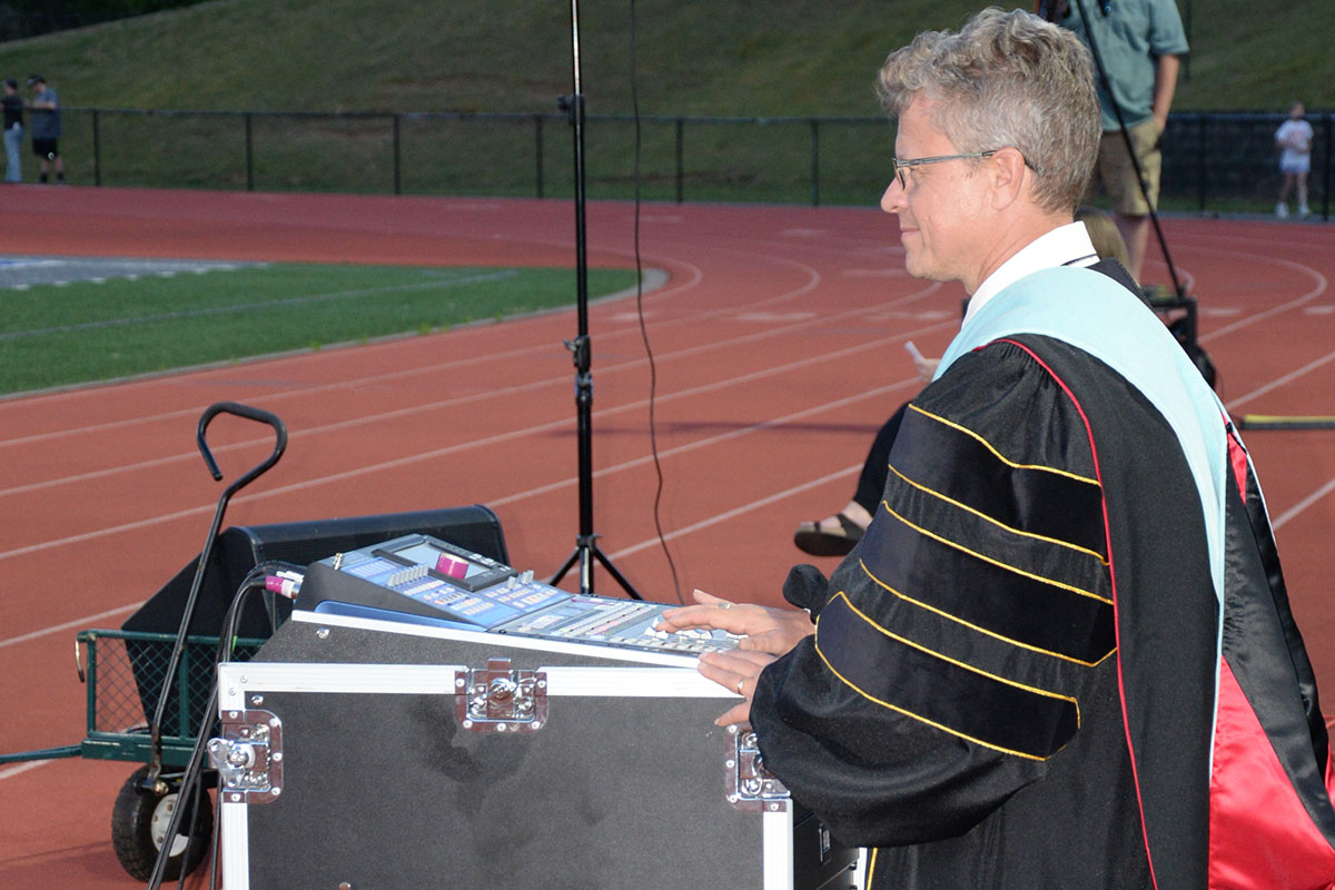 Fannin County High School Band Director Scott Barnstead did double duty at graduation, running the sound board for the band led by Carson Collis.
