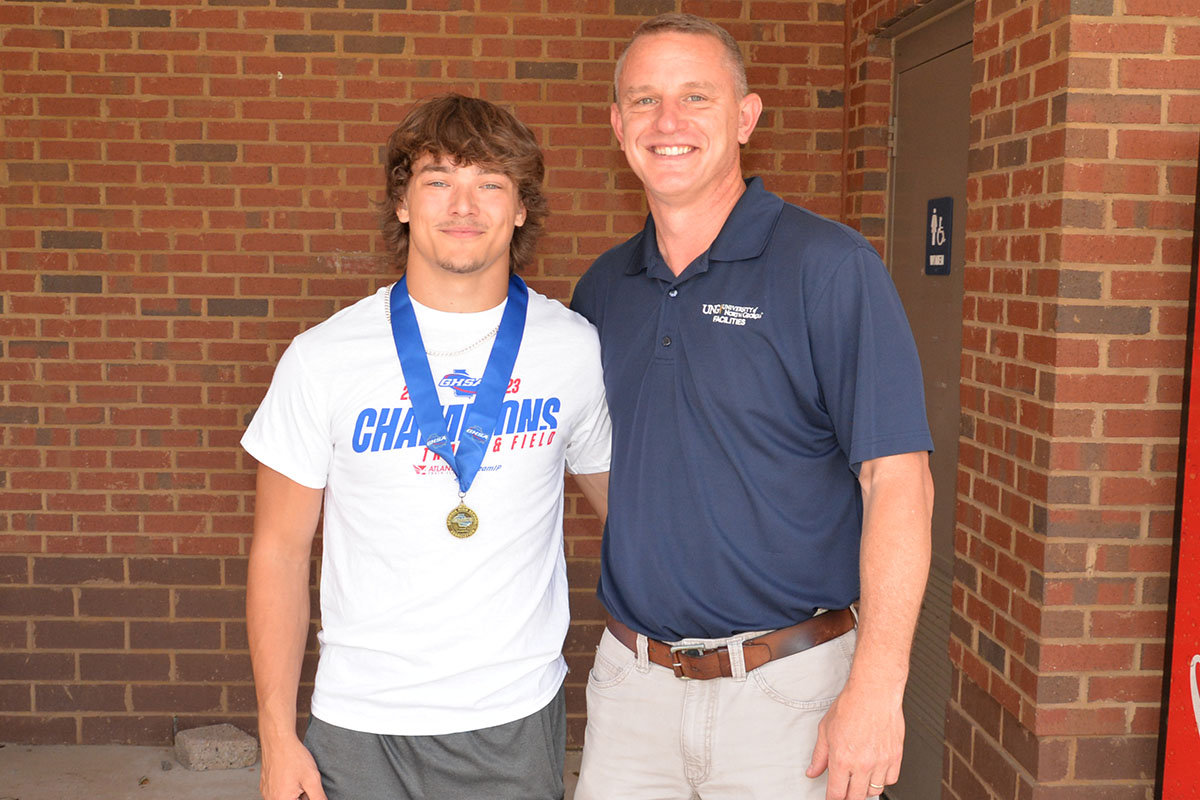 State Champion Pole Vaulter Corbin Davenport, left, is pictured with coach and Fannin’s last pole vaulting State Champion Chad Galloway, right. 