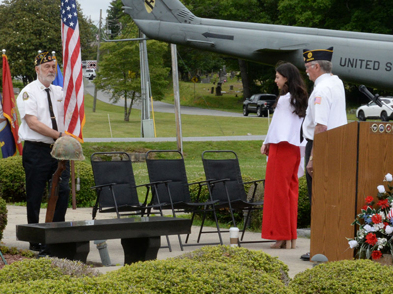 Steve Strickland retires the colors as Reese Lindstrom and Bill Stodghill look on at the conclusion of the Memorial Day ceremony.