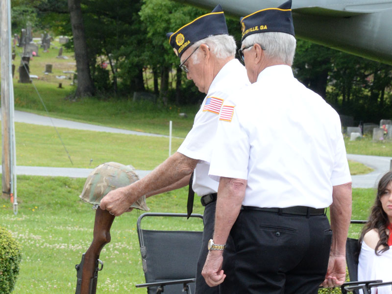 The Boots and Helmet memorial signifies a soldier’s last march onto the battlefield. The solemn ceremony was part of the Memorial Day observance at Veterans Memorial Park. 