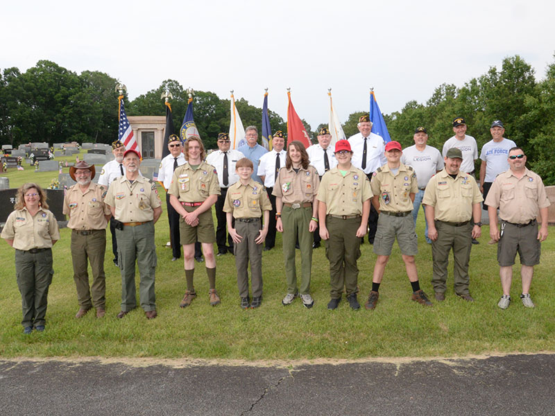 Members of several veterans organizations including the North Georgia Honor Guard joined with Boy Scouts from Troop 32 in Epworth for a ceremony and to place flags on the graves of veterans at Crestlawn Cemetery on Mobile Road. Shown at the conclusion of the event are, from left, front, Glenda Green, David Lewis, Nick Wimberley (also a veteran) Mathew Monroe, Clay Dillard, Stephen Young, Roy Green, Maddix Trantham, Raymond Green, and Tony Young, and, back Steve Strickland, Chris McKee, Richard Crosley, Bill
