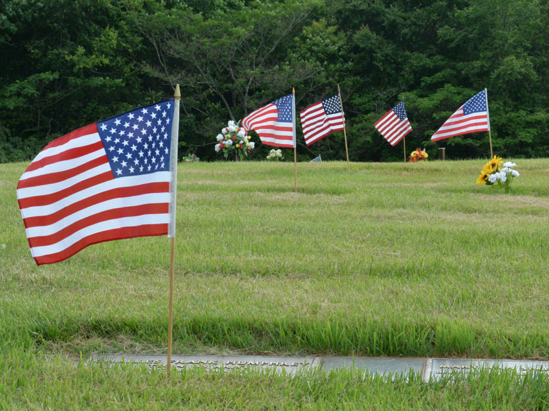Flags fly in honor of departed veterans.