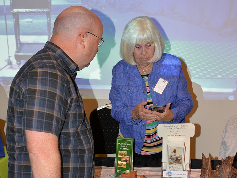 The Ducktown Basin Museum was one of the many organizations represented last Thursday night at Tooney’s as visitors learned the importance of recreation to the Ocoee/Toccoa area. Here, Myrna Brooks discusses the museum with a visitor.