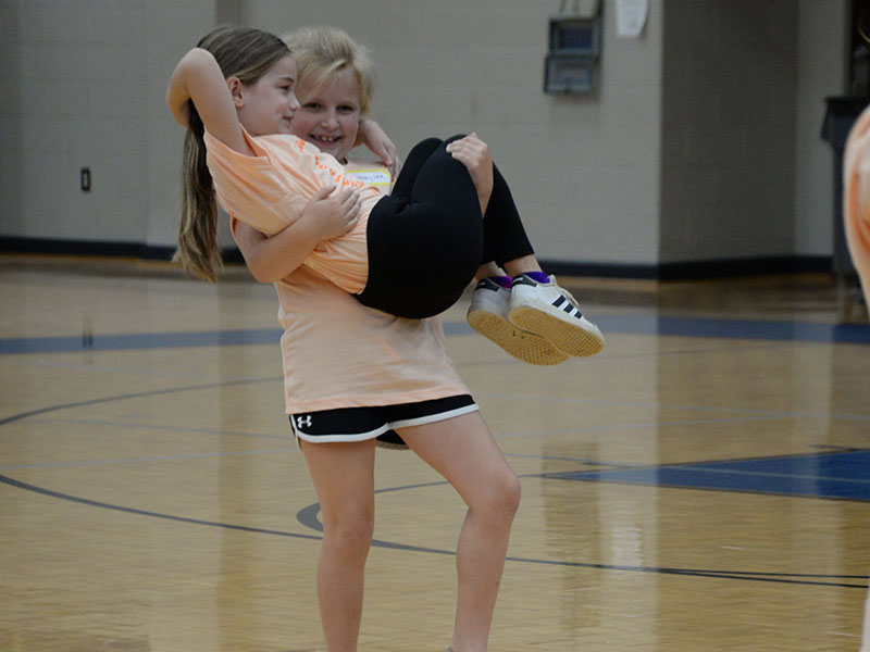 These two young dancers show off their skills for the crowd of parents and other family members at the conclusion of this year’s mini dance camp.