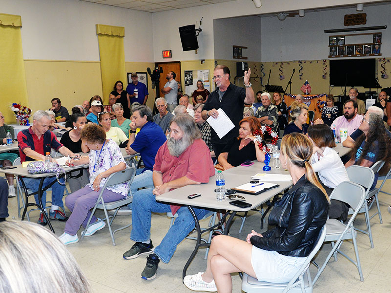 William Allen, standing in black shirt, was one of several area residents to speak when the Polk County commissioners listened to concerns over biosolids during their monthly meeting held Tuesday, June 27, at the Copper Basin Community Center.