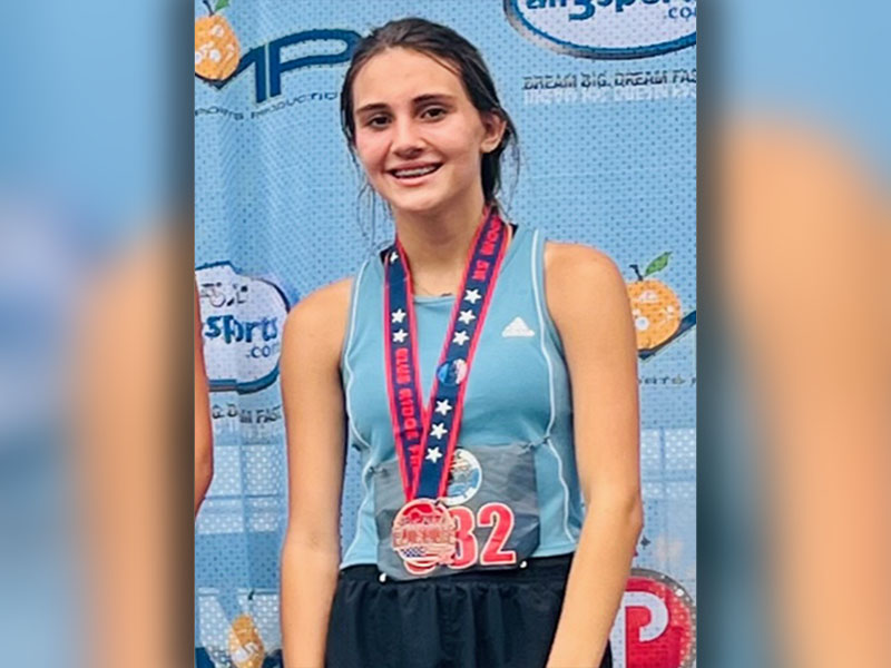 Karli Sams is shown with the medal she won as the third place finisher in the female 11 to 14 age group. She is an upcoming sophomore at Fannin County High School.  