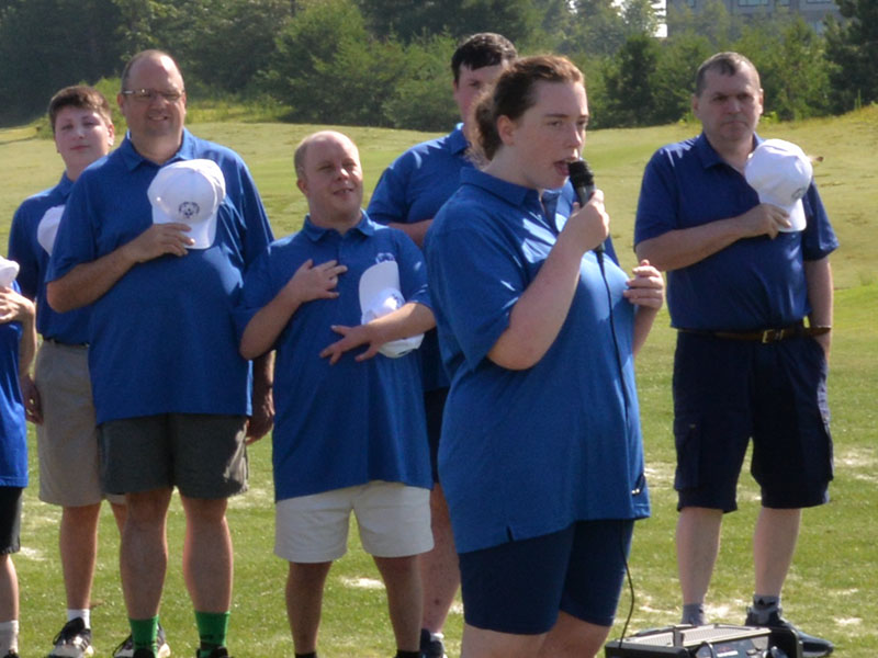 Ansley Price sang the National Anthem during the opening ceremony for the Special Olympics Golf Skills Event. Shown behind her are, from left, Alex Hughes, Rick Kruse, Jay Jenkins, Mikey Elliot, and Kevin Turner.