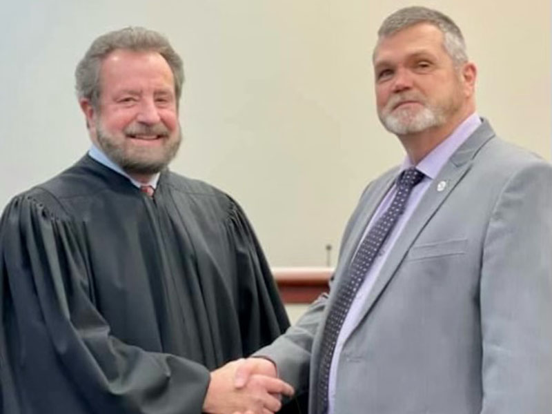 Judge John Worcester, left, is shown after swearing in Chief Magistrate Judge Brian Jones.