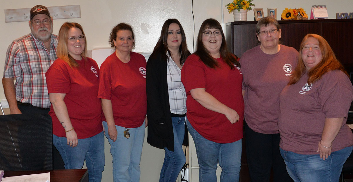 Not only did Fannin County’s seniors get to return to their home at the Fannin County Senior Center, but so did the crew from the Mountain Area Transportation System. Shown gathered in their new office last week are, from left, Mike Watkins, Jamie Thomas, Beverly Brown, Deborah Smith, Christina Sluce, Becky Davenport and Kristin Allen.