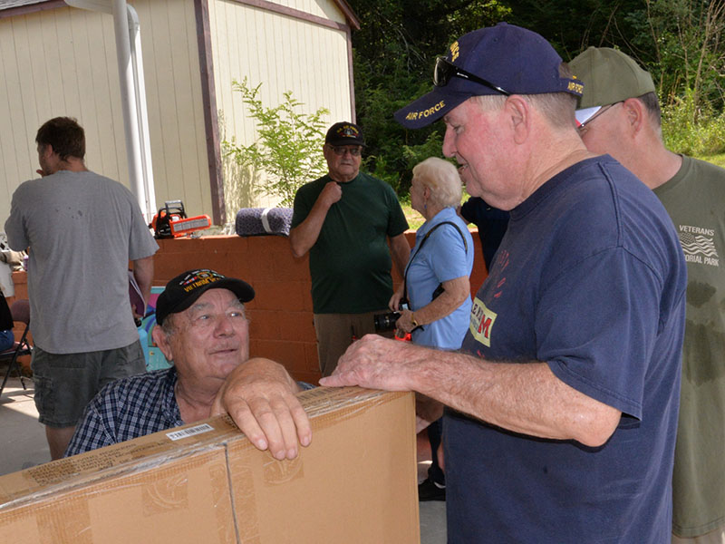 Paul Hunter, seated in the photo at left, presented Tommy Lee with a rocking chair donated by Ingles as his door prize for winning one of several drawings at the membership drive hosted by local veterans organization.