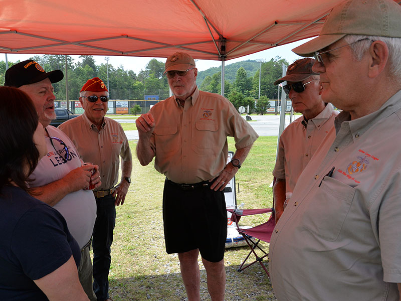 Discussing efforts to increase membership in local veterans organizations are, from left, Deb Calloway of the American Legion Auxiliary, Jim Callender of the American Legion, and Marine Corps League Detachment members Joel Warner, Dale Greene, Dick Evelyn and Ron Wikander. 