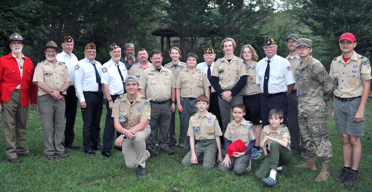 Boy Scouts from Troop 32 in Epworth, Webelos Cub Scouts from Pack 432 in Epworth, and members of the North Georgia Honor gathered at Ron Henry Horseshoe Bend Park outside McCaysville for a Flag Retirement Ceremony Tuesday, September 19. Those who took part in properly retiring the flag included, from left, kneeling in front, Sean Knight , Clay Dillard, Wyatt Craine and Dakota Davis; middle,  Nick Wimberley, David Lewis, Richard Crosely, Steve Strickland, Raymond Green, Patrick Thomas, Mathew Monroe, Bill St